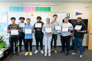 group of boys and girls holding certificates
