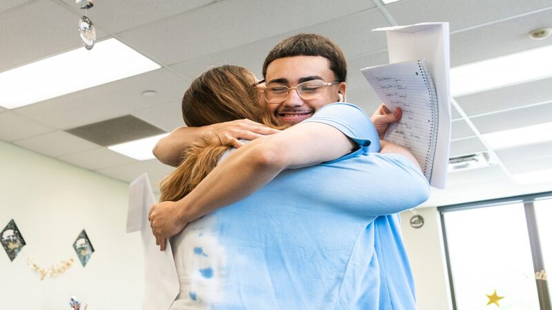 woman and male student hugging