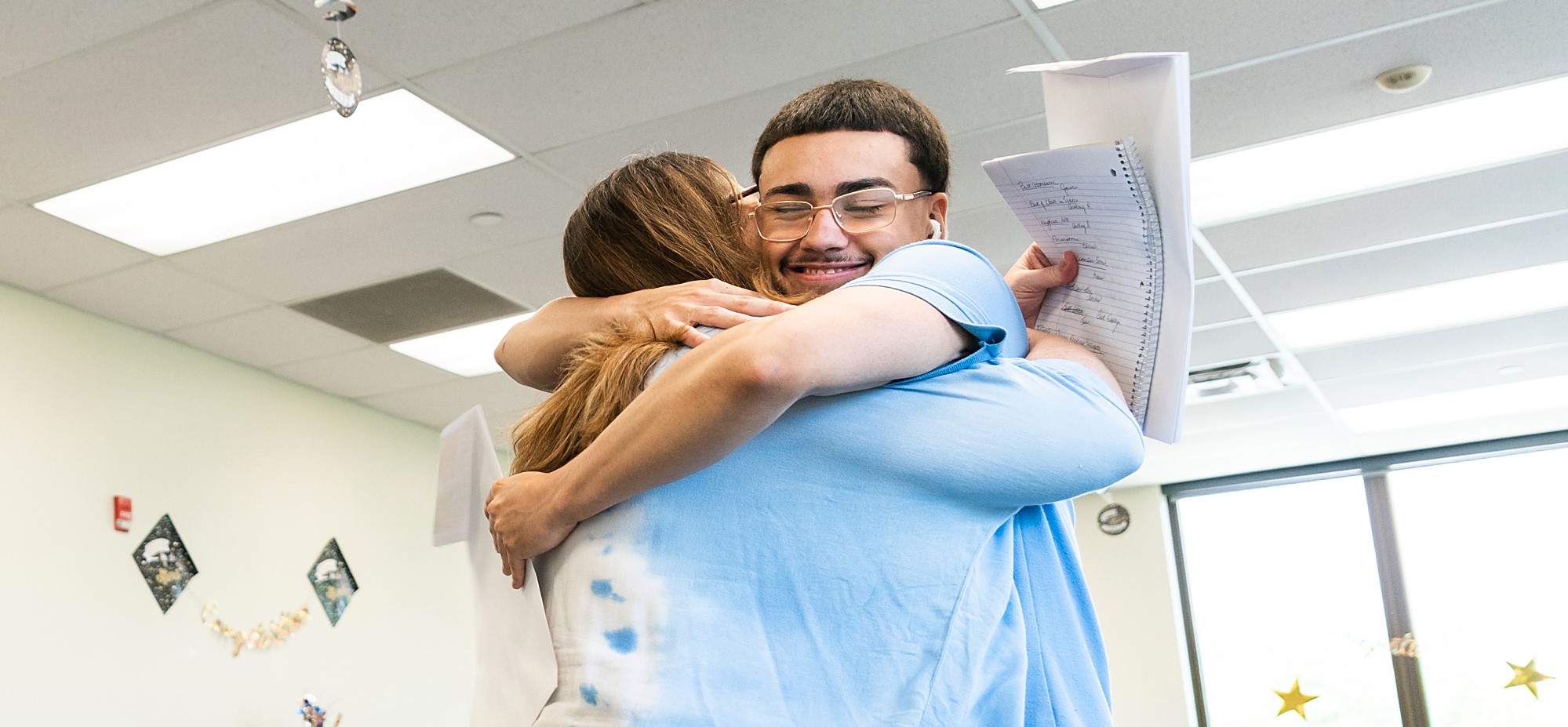woman and male student hugging
