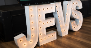 Light up sign of the letters JEVS
