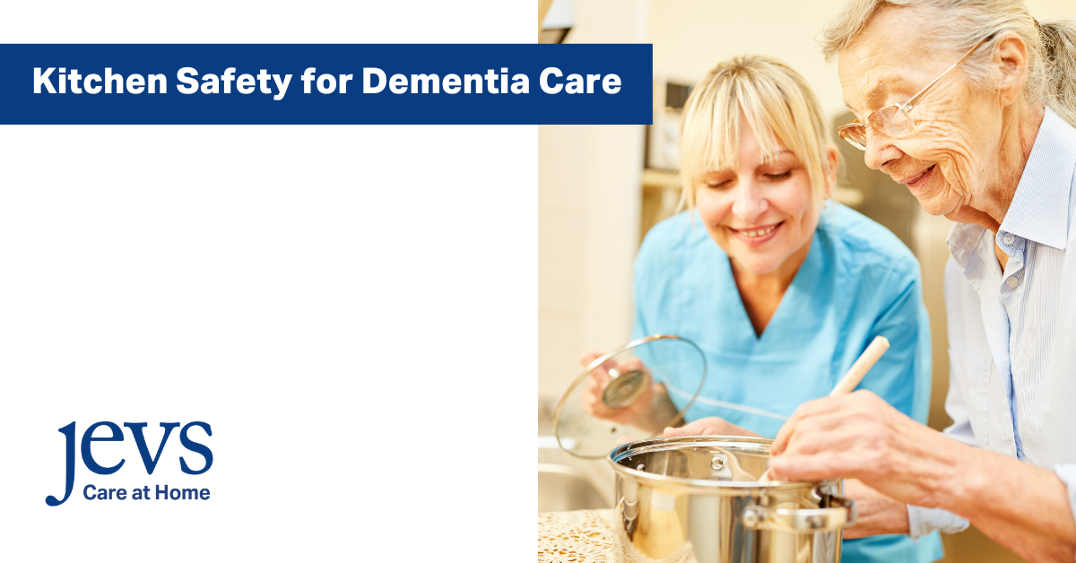 Image description. Text that says: Kitchen Safety for Dementia Care. Picture of older woman and younger woman in the kitchen stirring a wooden spoon in a pot. Includes JEVS Care at Home logo in the bottom left corner. End description.