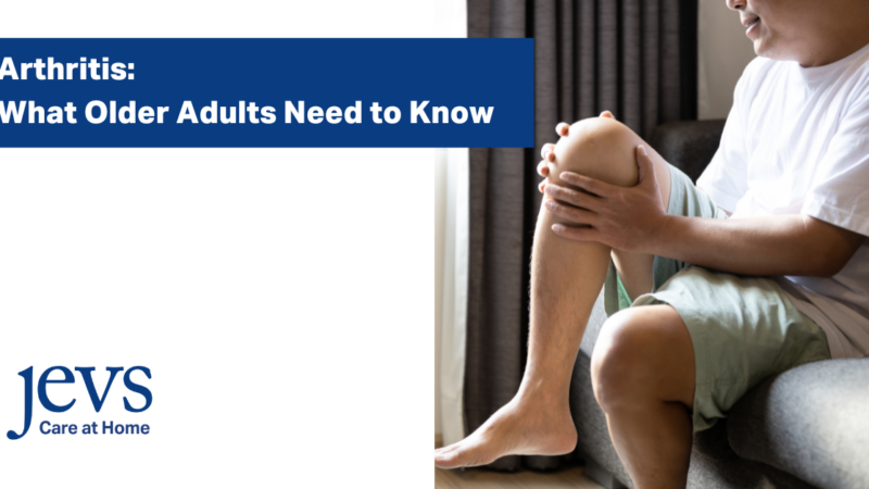 Image description. Navy blue box with text in white: Arthritis: What Older Adults Need to Know. JEVS Care at Home logo in the bottom left corner. Image of man holding his knee on right side of image. End description.