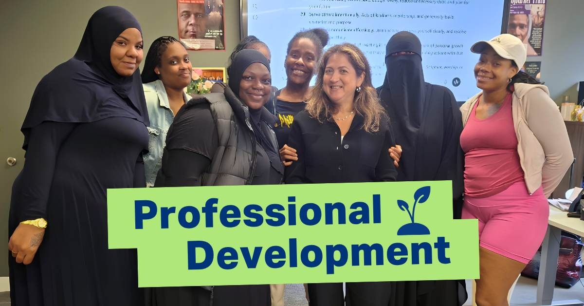 Participants in JEVS Work Ready Foundations Professional Skills class stand with JEVS President & CEO Cynthia Figueroa, smiling for the camera. A light green box at the lower center of the image has the words Professional Development and a plant icon in navy blue font.